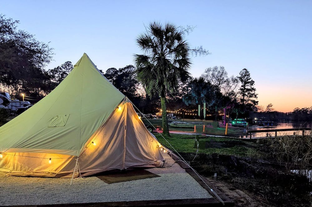 Eutawville RV Rental | Lakeside Glamping Tent with Kayaks & Spacious Deck in Eutaw Springs, South Carolina