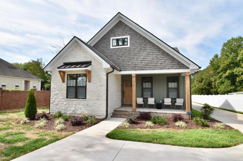 Gastonia House | Luxury New Construction Cottage with fireplace, office, and covered deck