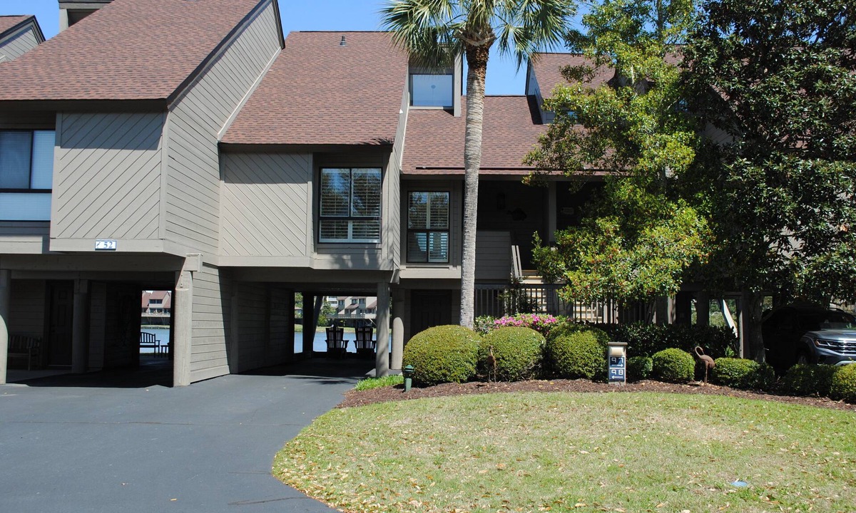 Litchfield by the Sea Condo | Villa with lake views and pool access located within gated Litchfield By the Sea community.