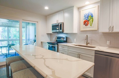 West Beach Village House | 90 Seconds to Beach! Fully Renovated Villa with Spacious Kitchen, Gorgeous Finishes & Screened Porch
