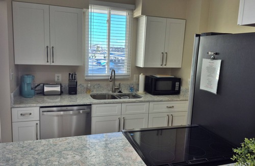 Midtown Ocean City Condo | BAY FRONT - Beautiful Sunsets - Walking distance to Beach, Shops, Eateries.