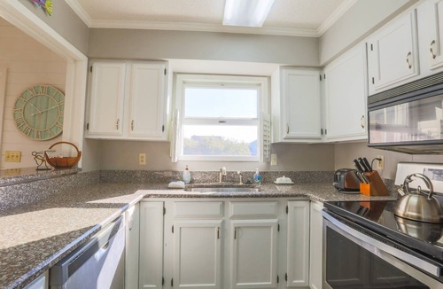 Pelican Bay House | Beach Home with Lagoon Views, Screened Porch, Deck & Community Pool. Only 5 Minute Walk to Beach!