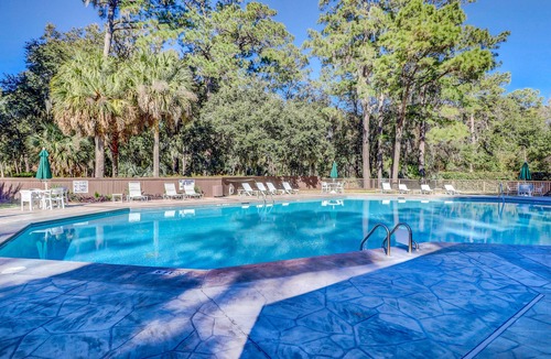 Sea Pines Condo | Beautiful villa with deck & shared pool, hot tub, tennis courts, sauna & more