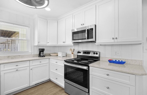 Litchfield by the Sea House | Canal Front Beach House, Screened Porch, 2 TV Dens, Dock, Short Block from Beach