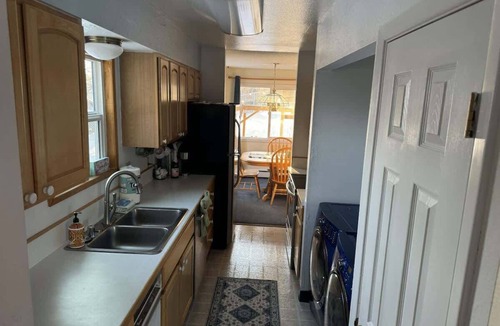 Sand Lake House | Cheerful 4 bedroom home with HOT TUB close to Airport