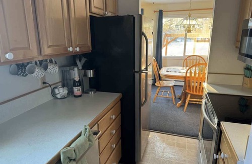 Sand Lake House | Cheerful 4 bedroom home with HOT TUB close to Airport