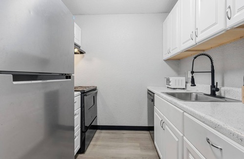 South Kansas City Apartment | Comfortable bedroom and cozy living space
