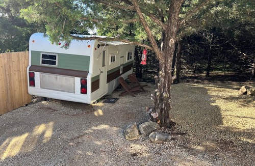 Chapman RV Rental | Cozy modified camper cabin