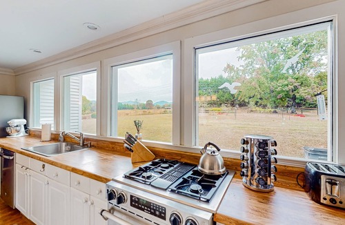 Landrum House | Dog-friendly farmhouse with hot tub, outdoor areas, & 3 fireplaces