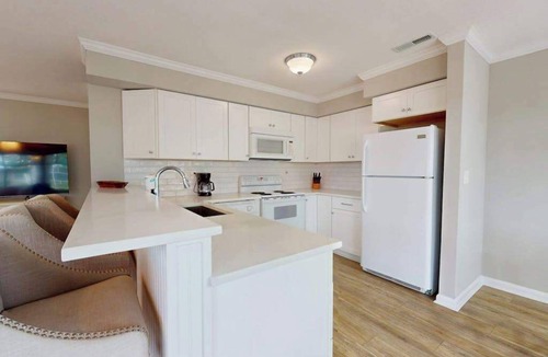 Fenwick Island Condo | East of Sun condo with water-view, on-site pool & tennis - near beach