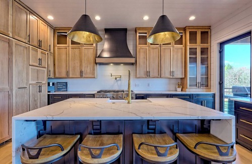 Elf House | Endless Sunsets by Chatuge Home Concierge | Lakefront home with private dock, covered boat slip, sun deck, hot tub, bar, fire pit, pool table, kayaks and EV charger. The perfect spot to relax, play, and enjoy unforgettable sunset views.