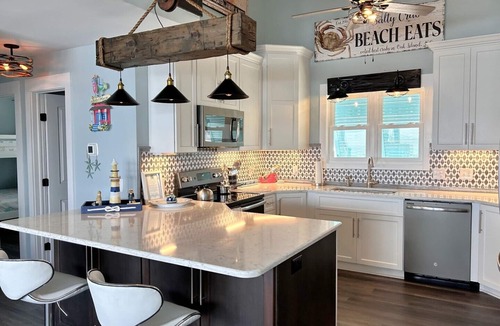 Oak Island House | Experience oceanfront bliss at Summer Wind West in Oak Island! Ideal for 12 guests.