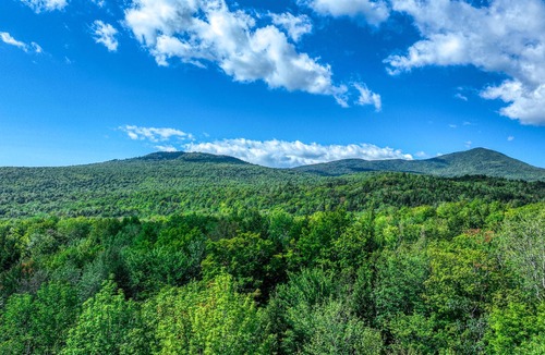Carrabassett Valley Cabin | Gorgeous dog-friendly cabin with great view, deck, hot tub, & gas fireplace