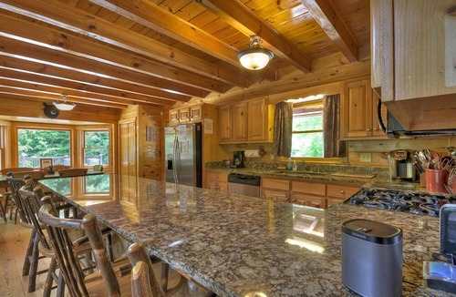 Ellijay Cabin | Hunter's Lodge, a pet-friendly riverfront cabin, complete with a pool table, lit basketball court, fire pit, dock, and WiFi