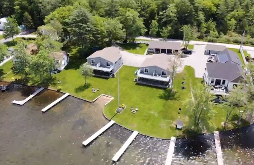 Lochmere House | Lakefront 3-bedroom Duplex on Lake Winnisquam, docks, Beach, WiFi, AC. B2B