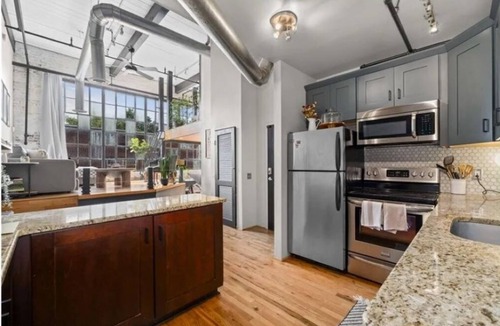Castleberry Hill Condo | Midcentury Modern loft in Castleberry Hill with patio, parking & sleek updates.