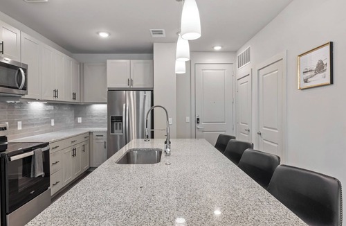 Windsor Park Apartment | Modern 2BR Poolside Patio Suite in North Austin