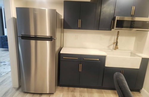 Shrewsbury Condo | Modern Basement Suite King Bed and 100” TV