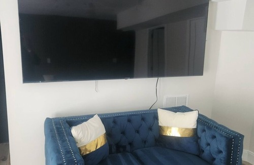 Shrewsbury Condo | Modern Basement Suite King Bed and 100” TV