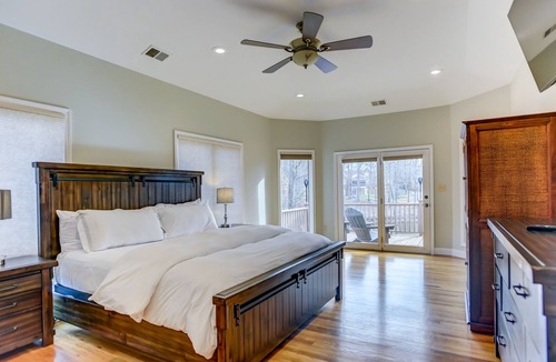 Terrell House | Southern Exposure - Charming Lake Front Home - Private Dock, Screened in Porch, Hot Tub