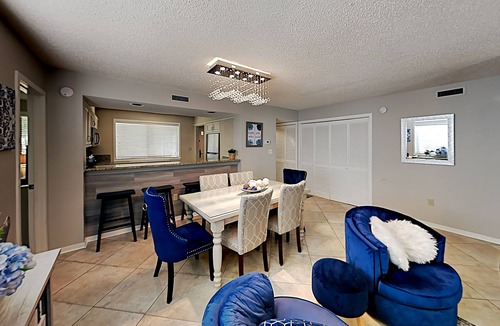 Arcadian Shores Condo | Stylish home with oversize deck & updated kitchen - walk to beach, pools, & gym