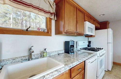 The Bays Cottage | Tranquil lakefront cottage with private beach, boat slip & fishing kayak access