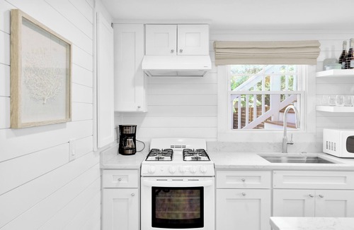 Folly Field House | Updated 4th row beach home, private pool, fenced in yard, and putting green!