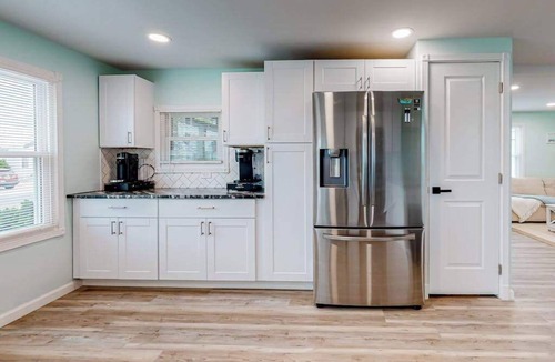 Montego Bay House | Updated dog-friendly home with gas grill, 2 pools, 2 tennis courts, fishing pier