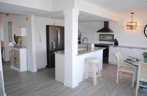 Litchfield by the Sea Condo | Villa with lake views and pool access located within gated Litchfield By the Sea community.