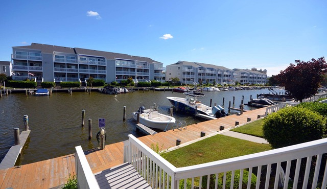 Cozy, inviting 1 bedroom condo with an outdoor pool and gorgeous canal-front view located uptown on the bayside just a few blocks from the beach!
