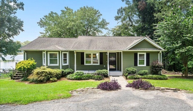 Experience Serenity on Broadway Lake in this beautiful 3 bedroom home
