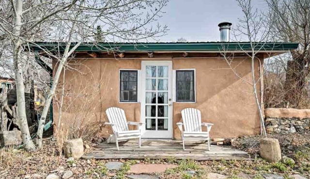 Log Casita Overlooking Pond and Waterfall near Taos, New Mexico