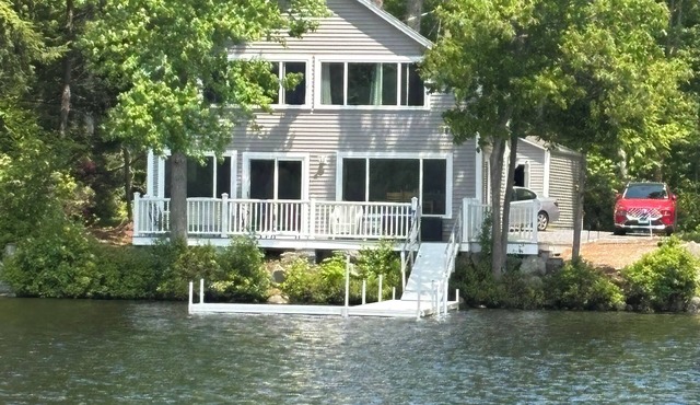 Newly renovated lake front home with dock and sunset views of Laurel Lake