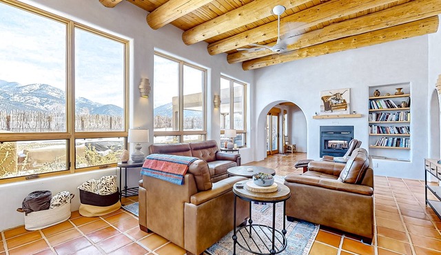 Renovated mountain-view villa with private hot tub, roof deck, & enclosed yard