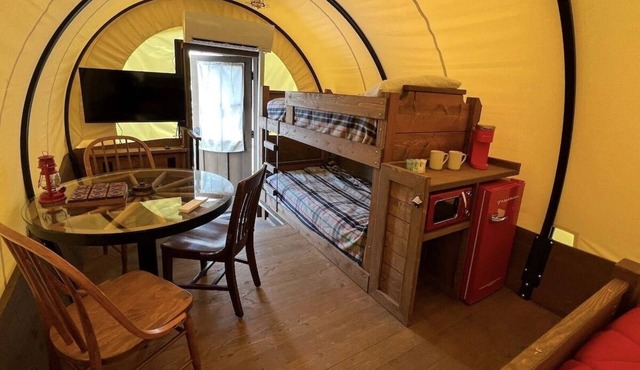 Stay in a unique Conestoga Wagon with room for 4