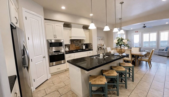 Two heated pools/spas, pond, backyard w/BBQ