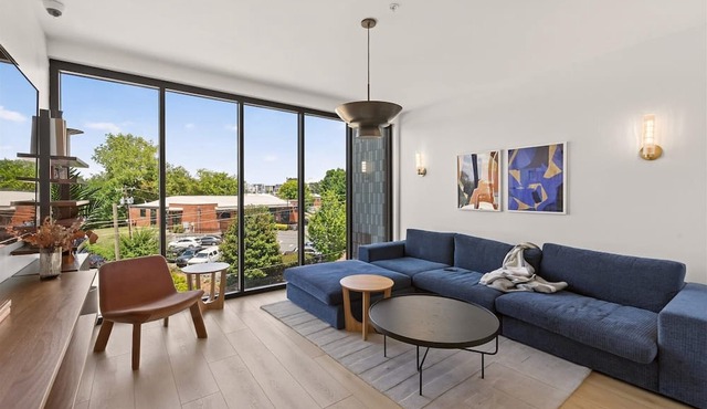 Light filled new 2 BR in the heart of Charlotte's dynamic South End. Steps to the Rail Trail + Light Rail = easy access to Uptown events. Rooftop Lounge w/skyline views, and luxe shared co-working spaces. Perfect for work, play or extended stay.